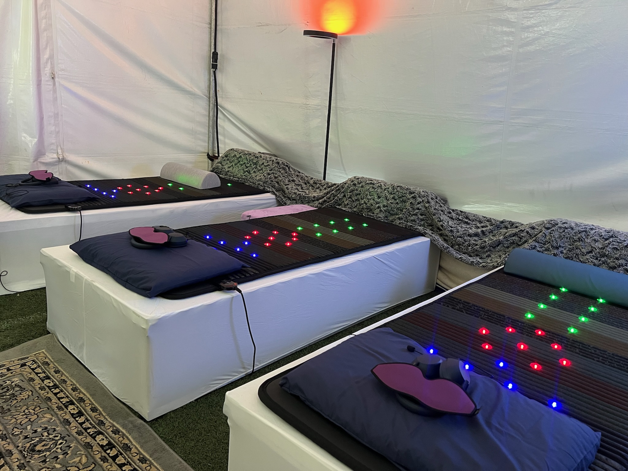 Three VAVE beds set up inside the PORTAL Dome at the MAPS Psychedelic Science Conference 2025, prepared to deliver Multisensory Resonant Frequency Therapy demo sessions using sound, vibration, and integrated light modalities.
